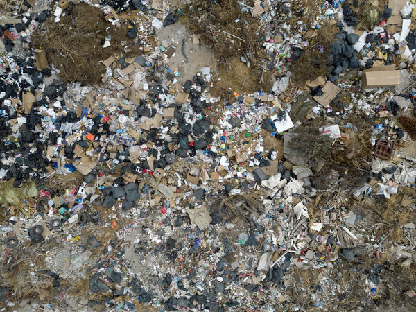 A Drone Aerial top view large garbage pile, Garbage pile in trash dump or landfill mountain garbage