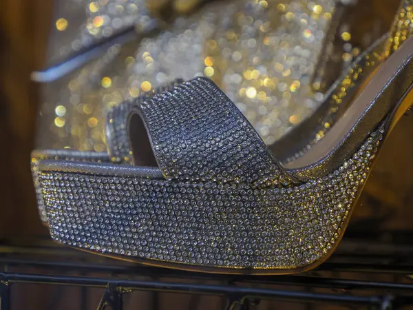 Woman diamond shoes in shop window detail