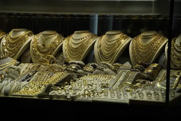 A gold shop windows at istanbul grand bazar or Kapali Carsi, Turkey. Jewelry in the store window. A lot of luxury jewelry in the oriental market. Concept of shopping in Middle East.