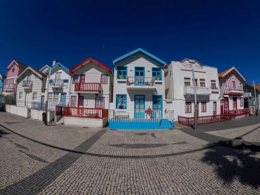 Striped Painted houses in Beach Praia Costa Nova do Prado in Aveiro, Portugal clipart