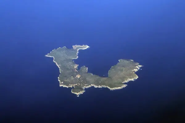 stock image The Giannutri Island aerial view from airplane window