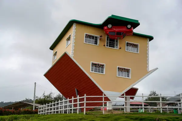 stock image A Weird upside down house in Colombia. Bizarre wooden home. Funny architecture