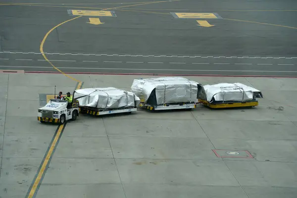 stock image BOGOTA, COLOMBIA - JULY 11 2024 - el dorado airport operations with airplans and cargo and workers