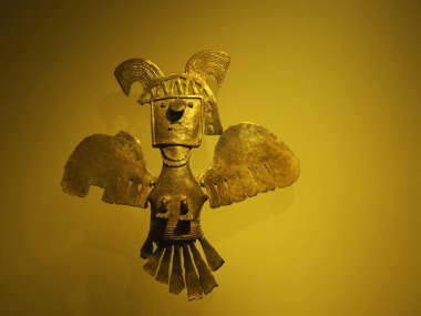 BOGOTA, COLOMBIA - JULY 3, 2024: Superb Gold artifacts on display in the Museo del Oro (Gold Museum). Isolated on background clipart