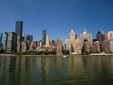 new york city manhattan skyscrapers building view from Roosvelt island clipart