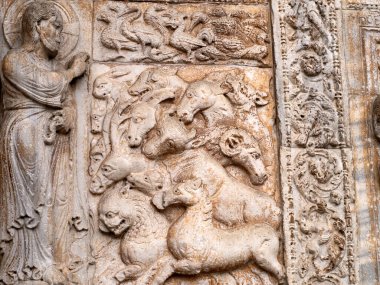 The San Zeno Basilica Church in Verona Italy, detail of exterior sculptures and bas relief clipart