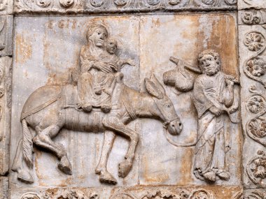 The San Zeno Basilica Church in Verona Italy, detail of exterior sculptures and bas relief clipart