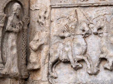 The San Zeno Basilica Church in Verona Italy, detail of exterior sculptures and bas relief clipart