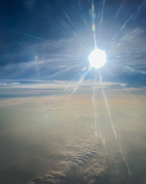 Aerial photography where clouds and rays of sunlight give beauty to the image. The blue sky in the background.