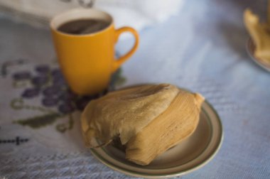 Delicious bread tamale, accompanied by tamarind atole, typical food from Uruapan, Michoacan, Mexico. clipart