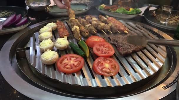 Handheld Shooting Hand Cooking Grilled Veal Lamb Meat Mushrooms Tomatoes — Stock video