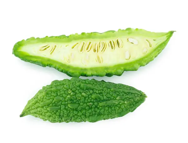 stock image slices of bitter gourd arranged on white background