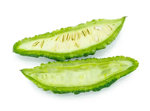 stock image slices of bitter gourd arranged on white background