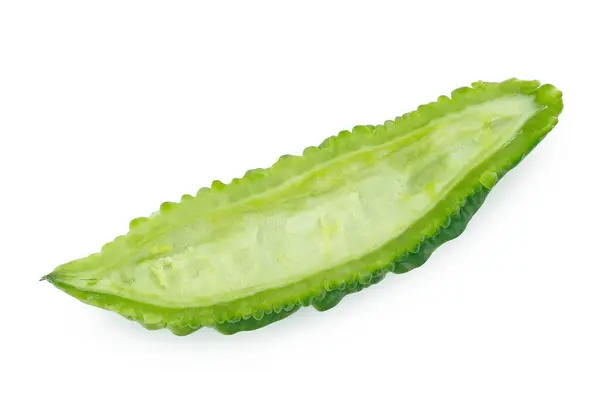 stock image slices of bitter gourd arranged on white background