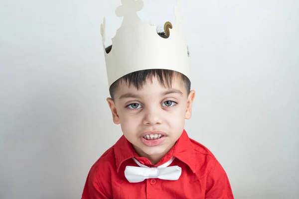 Cute boy with classic clothes - With paper crown