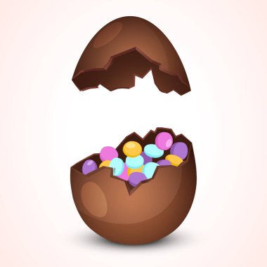 Paskalya tatili, çikolatalı yumurtanın içinde beyaz arka planda izole edilmiş farklı küçük şekerler barındırıyor..