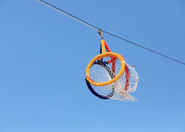 Takraw lod loop with blue sky background. clipart