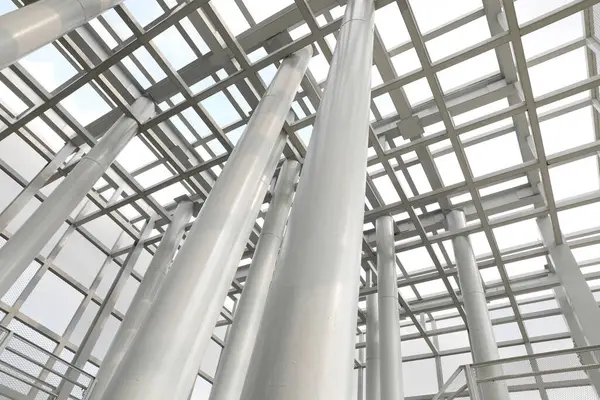 White steel ceiling structure with surrounding walls are lined with steel grids inside tha Bird Watch Tower at Pupha Mahanatee Garden in Queen Sirikit Park in the centre of Bangkok, Thailand.