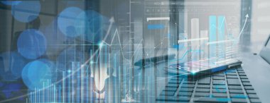 Office finacial business workplace with laptop and smart phone and stylus showing virtual innovaton business management dashboard.