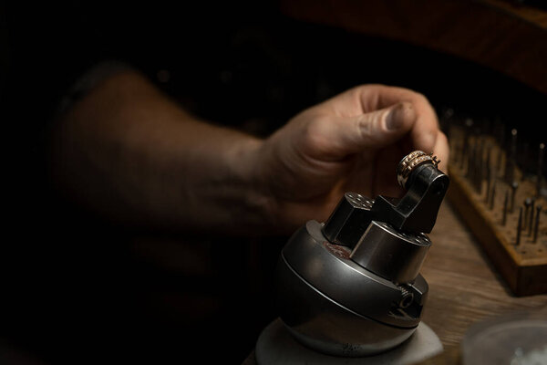 The work of jewelers. Trial jewelry of semiprecious metals. Ring. Selective focus. Macro photo.