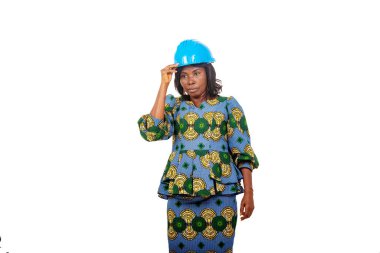 portrait of a female engineer wearing safety cap.
