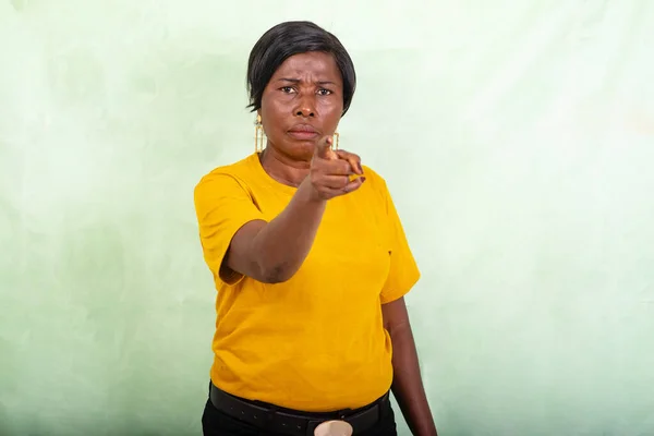 Beautiful Mature Woman Yellow Shirt Standing Green Background Doing Warning — Stock Photo, Image
