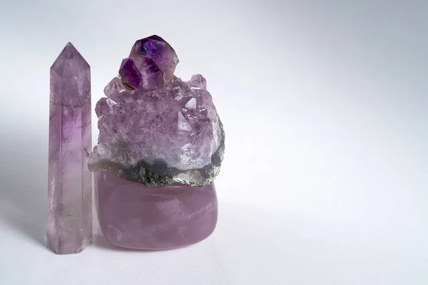 Four different amethyst crystals on a white background.High quality photo
