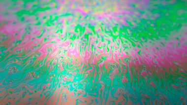 Iridescent multicolored bright abstract soapy water background. Space background for screensaver. High quality photo clipart