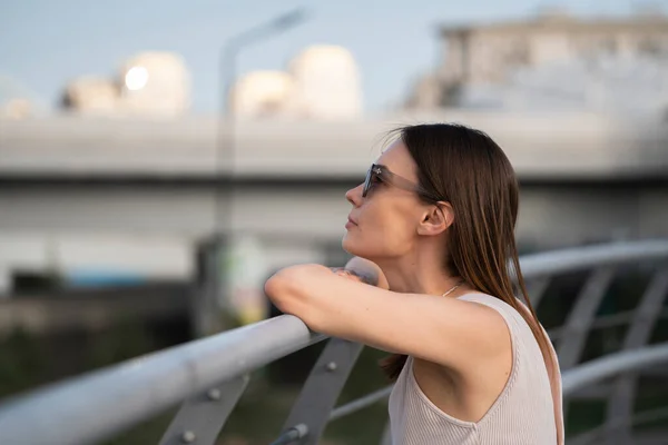 stock image Urban summer portrait of young brunette woman. The woman thought about something. High quality photo