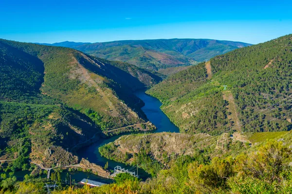 Stock image Panorama of Navea river passing Pontenovo hydro power plant in Spain.