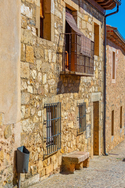 Narrow street in medieval village Pedraza in Spain.