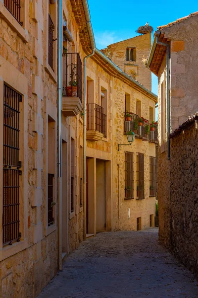 stock image Narrow street in medieval village Pedraza in Spain.
