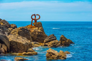 Peine de los Vientos sculpture at seaside of San Sebastian, Spain. clipart