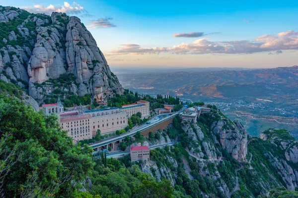 stock image Sunset panorama view of Santa Maria de Montserrat abbey in Spain.