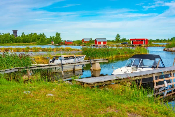 stock image Red timber boat houses at Svedjehamn in Finland.