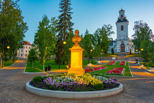Sunset view of the cathedral behind Snellman Park in Kuopio, Finland.