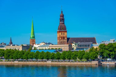 View of the Riga cathedral and saint James church from the other side of the Daugava river, Latvia..