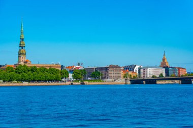Panorama of riga including saint peters church, the zeppelin hangars and the academy of sciences .