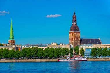View of the Riga cathedral and saint James church from the other side of the Daugava river, Latvia..