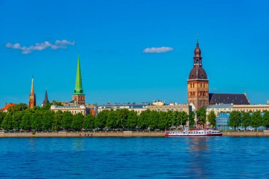 View of the Riga cathedral and saint James church from the other side of the Daugava river, Latvia..
