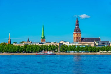 View of the Riga cathedral and saint James church from the other side of the Daugava river, Latvia..