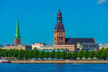 View of the Riga cathedral and saint James church from the other side of the Daugava river, Latvia..