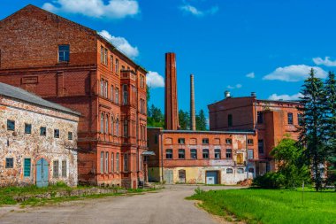 Old paper mill in Latvian town Ligatne. clipart