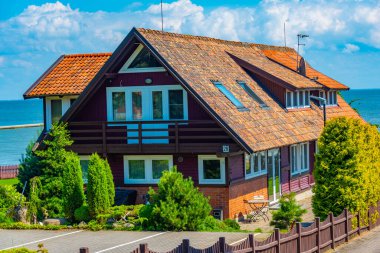 Colorful house at Lithuanian village Nida. clipart