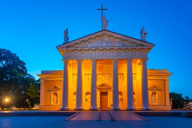 Saint Stanislaus cathedral in the lithuanian capital vilnius during night.. clipart