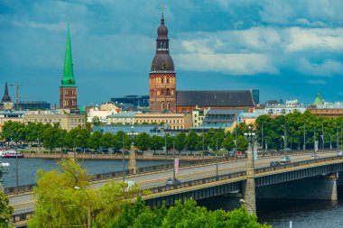 View of the Riga cathedral and saint James church from the other side of the Daugava river, Latvia..