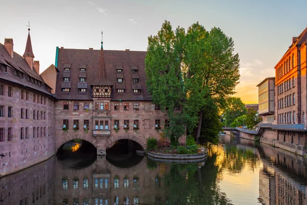 stock image Sunrise view of Nurnberg Heilig Geist Spital building (Hospital of the Holy Ghost) in Nurnberg, Germany..