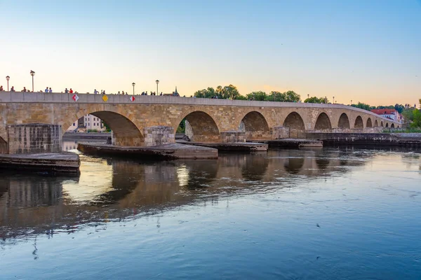 stock image Old stone bridge over river Danube in Regensburg, Germany.