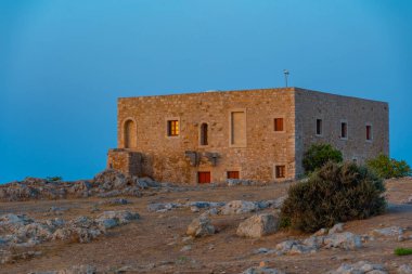 Yunan kenti Rethimno, Girit 'teki Venedik Fortezza Kalesi' ndeki binaların günbatımı manzarası.