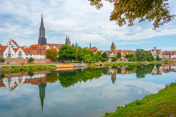 stock image Cityscape of German town Ulm reflecting on river Danube.